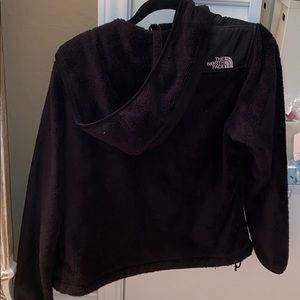 Black fuzzy north face jacket with hood